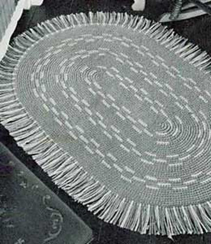 The Gray and White Oval Rug