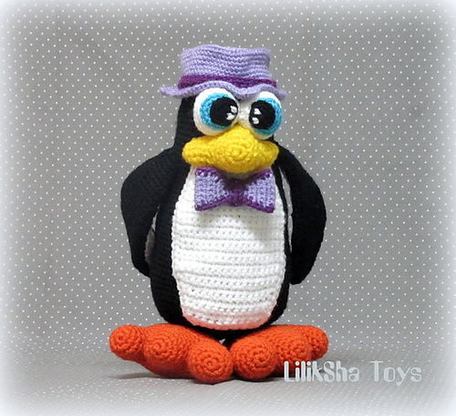 Penguin wearing a hat and a bow tie.