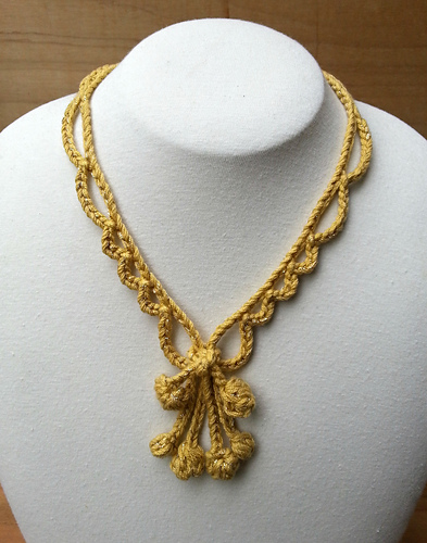 Looking Glass Necklace With Knot Center