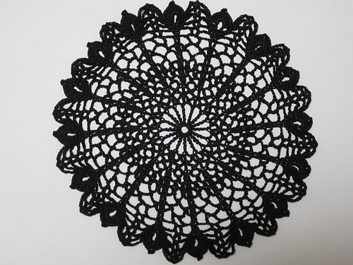 Large flower with a butterfly fluttering doily