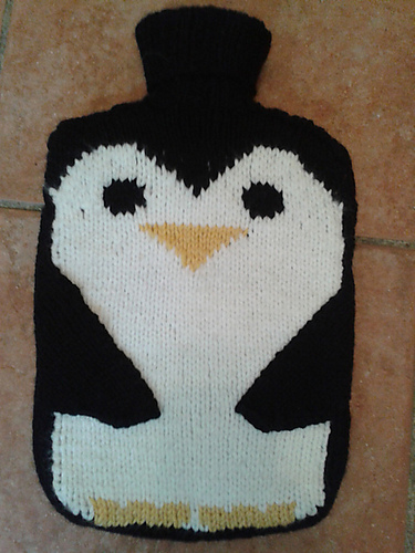 Penguin hot water bottle cosy